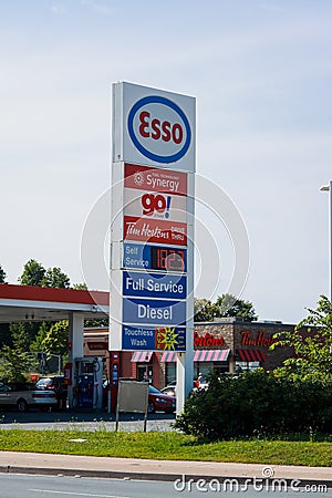 ESSO Gas (aka ExxonMobil) Station store front. An American oil company is one of the leading brands in Atlantic Canada Editorial Stock Photo