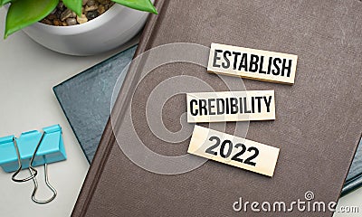 ESTABLISH CREDIBILITY. Conceptual image. text on wood cubes. text in black letters on wood blocks Stock Photo