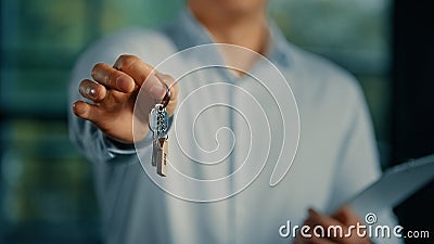 Estate agent salesman banker businessman show at camera bunch of keys from new house commercial offer housing mortgage Stock Photo