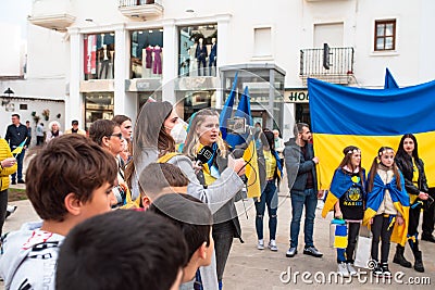 Anti-war demonstration. Female journalist is filming and making interview. Editorial Stock Photo