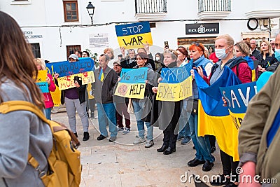 Estepona, Andalusia, Spain - March. 05, 2022. Protestors rally in support of Ukraine against russian agression. Anti-war Editorial Stock Photo