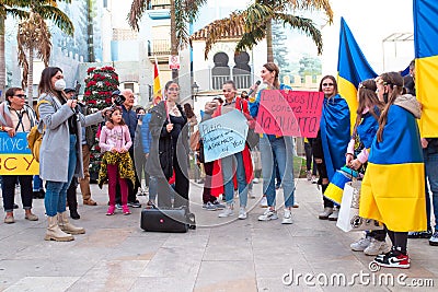 Estepona, Andalusia, Spain - March. 05, 2022. Protestors rally in support of Ukraine against russian agression. Anti-war Editorial Stock Photo