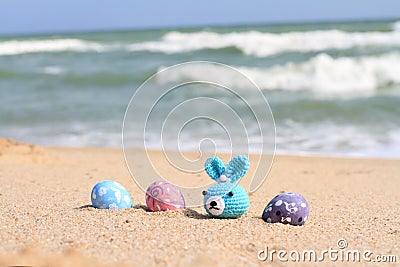 Ester day beautiful egg and rabbit on beach Stock Photo