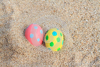 ester day beautiful pink, yellow egg on beach background Stock Photo