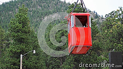 ESTES PARK, CO, U.S.A, JULY 8, 2018 - Red funicular coming down the mountain to load tourists on the tramway Editorial Stock Photo