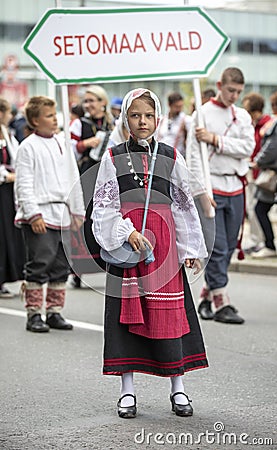 Estonian people in traditional clothing walking the streets of Tallinn Editorial Stock Photo
