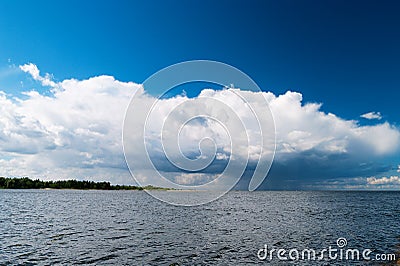 Estuary of the Vistula River to the Baltic Sea with the Cumulus mediocris cloud in the sky. Stock Photo