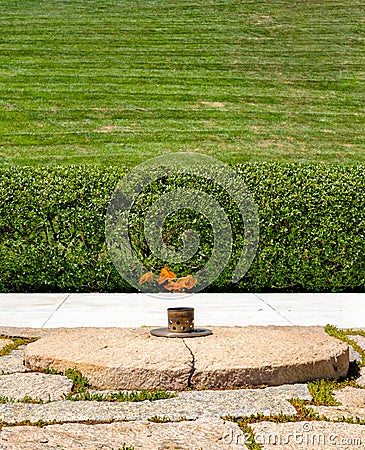 Eternal Flame next to the John F. Kennedy grave at Arlington Nat Editorial Stock Photo