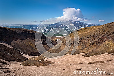 Eternal snow in a rocky canyon on Mutnovsky Volcano Stock Photo