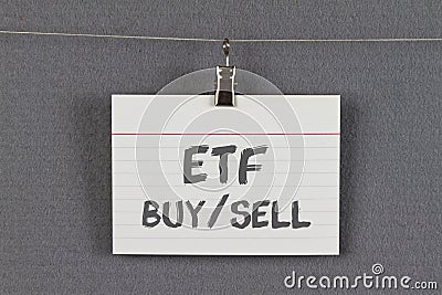 ETF buy and sell written on an index card Stock Photo