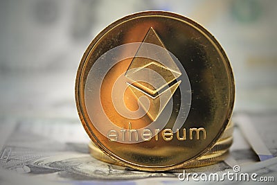 Ether ETH Ethereum coin on hundred dollars bills. Close-up, macro shot Editorial Stock Photo