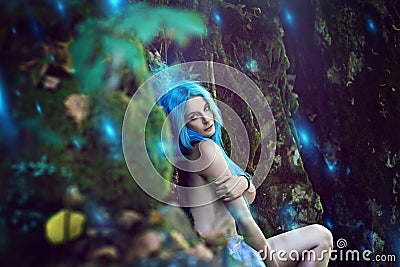 Ethereal nymph with surreal forest lights Stock Photo