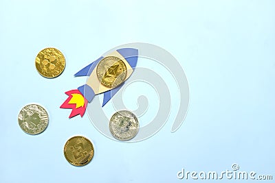 Ethereum coin surpass and overtake Bitcoin coin on rocket paper cutout with copy space. Competition in cryptocurrency and Ethereum Editorial Stock Photo