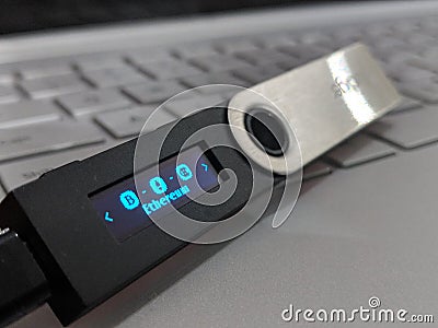 Ethereum Hardware Wallet On Laptop Keyboard Stock Photo