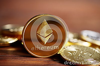 Ethereum on the pile of cryptocurrency on wooden table as most important cryptocurrency concept. Editorial Stock Photo