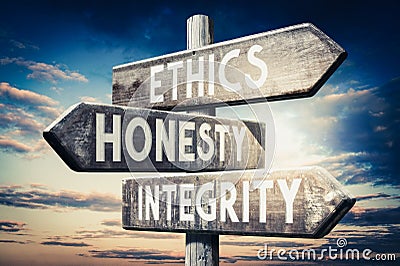 Ethics, honesty, integrity - wooden signpost, roadsign with three arrows Stock Photo