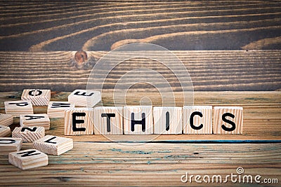 Ethics. Wooden letters on the office desk, informative and communication background Stock Photo