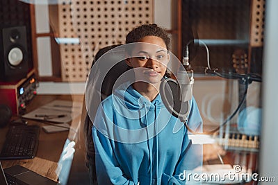 Ethinc pretty woman sound engineer, music composer, anchorwoman, radio presenter in the sound and audio recording studio Stock Photo