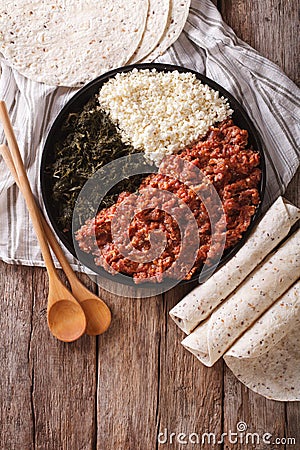 Ethiopian cuisine: kitfo with herbs and cheese. Vertical top vie Stock Photo