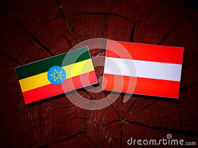 Ethiopian flag with Austrian flag on a tree stump Stock Photo