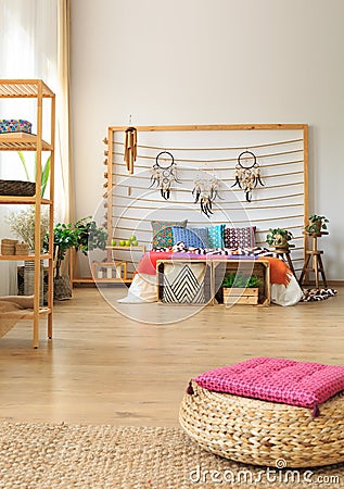 Bedroom with shelves and ottoman Stock Photo