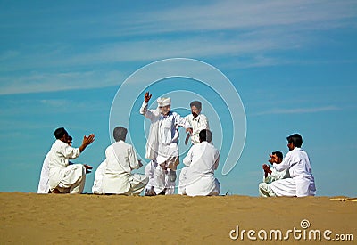 Persian folk dancers on sand dune in a festival in Eastern Iran Editorial Stock Photo