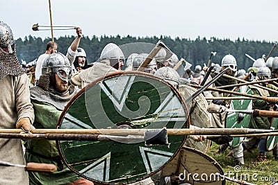 Ethnic Festival of Ancient Culture. Reconstruction of medieval warriors of knights in battle Editorial Stock Photo