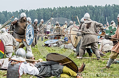 Ethnic Festival of Ancient Culture. Reconstruction of medieval warriors of knights in battle Editorial Stock Photo