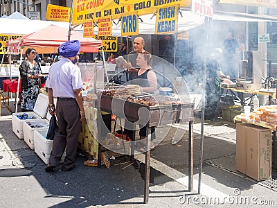 Ethnic food for sale at a street stand in downtown New York Editorial Stock Photo