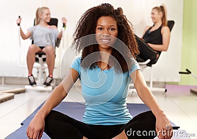 Ethnic girl relaxing at the gym Stock Photo