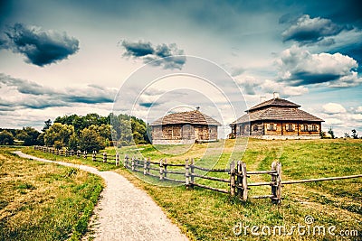 Ethnic house on rural landscape Stock Photo