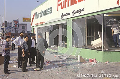 Ethnic men observing furniture store looted during 1992 riots, South Central Los Angeles, California Editorial Stock Photo