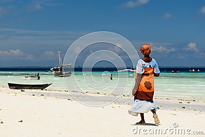 Ethnic women on sandy beach, Africa Editorial Stock Photo