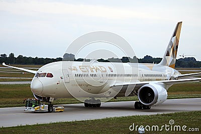 Etihad Airways plane being towed, closeup Editorial Stock Photo