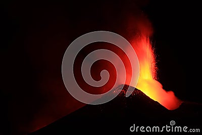 Etna - Lava explosion from crater during volcanic eruption at night with black background Stock Photo