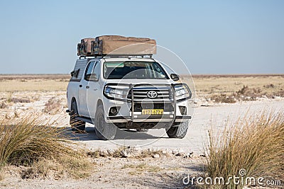 Etosha, Namibia, Africa, June 18, 2019: Toyota Hilux specially equipped for travel and Gipsy Adventure house on roof Editorial Stock Photo