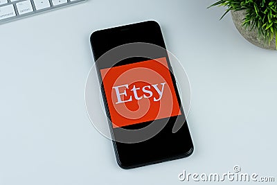 Etsy app logo on a smartphone screen. Editorial Stock Photo