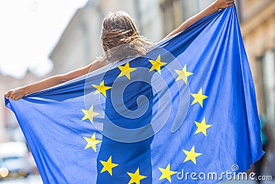 EU Flag. Cute happy girl with the flag of the European Union. Yo Stock Photo