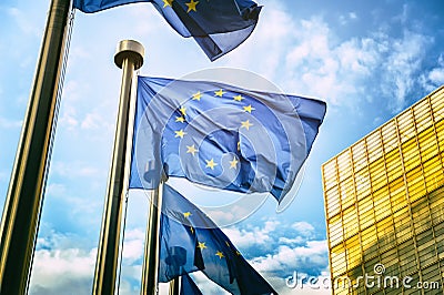 EU flags in front of European Commission in Brussels Stock Photo