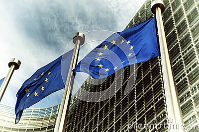 EU flags in front of European Commission building Stock Photo