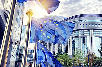 EU flags waving in front of European Parliament building in Brus Stock Photo