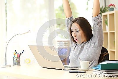 Euphoric and surprised winner winning online Stock Photo