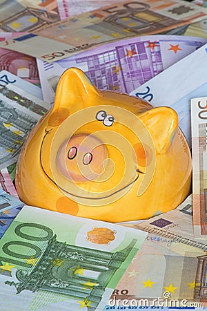 Euro Bank notes with a piggy bank showing Drowning in money Stock Photo