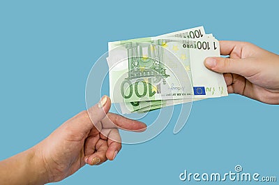 100 euro banknotes in female hands. The concept of corruption. to give a bribe. Giving or taking money. Hands with euro o Stock Photo