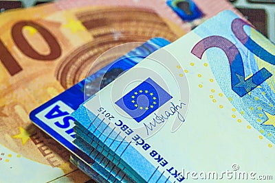 Euro banknotes and visa card Editorial Stock Photo