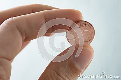 Euro cents, The Euro coin on finger tips, Stock Photo