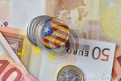 Euro coin with national flag of catalonia on the euro money banknotes background Stock Photo