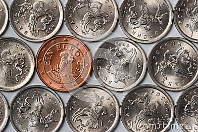 Euro coin among russian coins Stock Photo