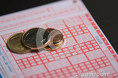 Euro coins on a ballot of the Spanish pool Editorial Stock Photo