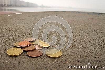 Euro coins on the cement floor Stock Photo